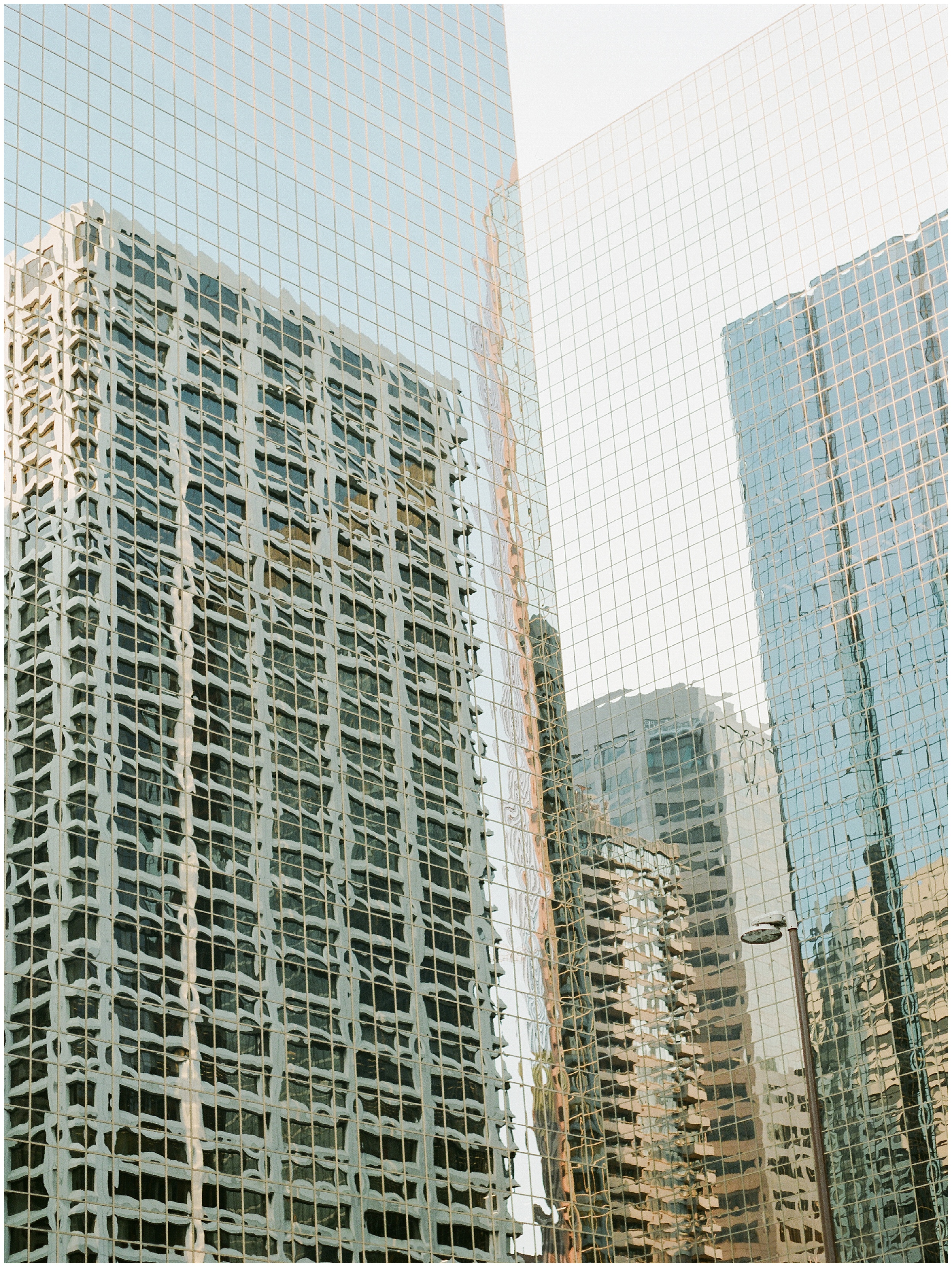 reflection of skyscrapers in glass in Calgary Alberta