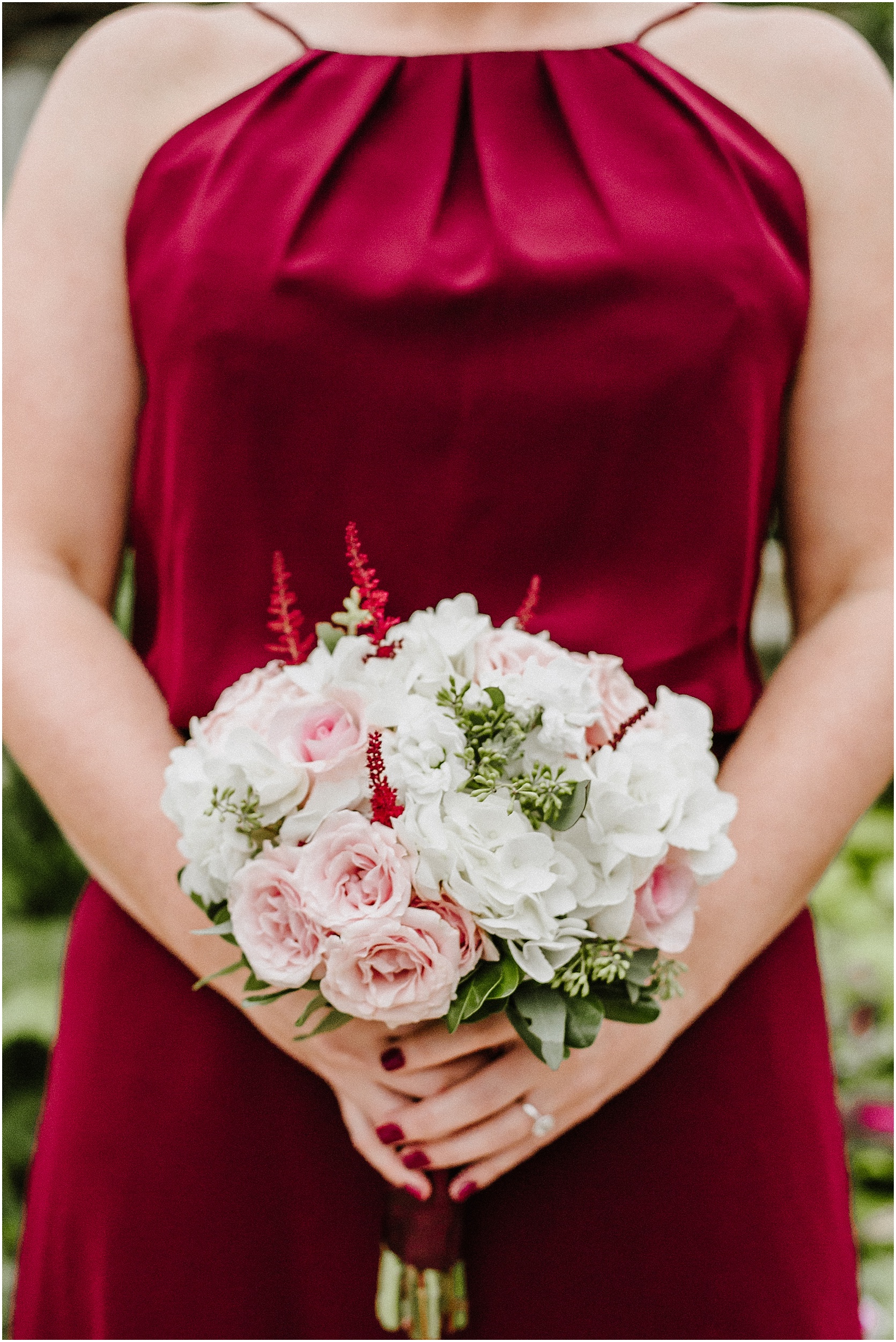 bridesmaid holding burgundy and blush fall bouquet