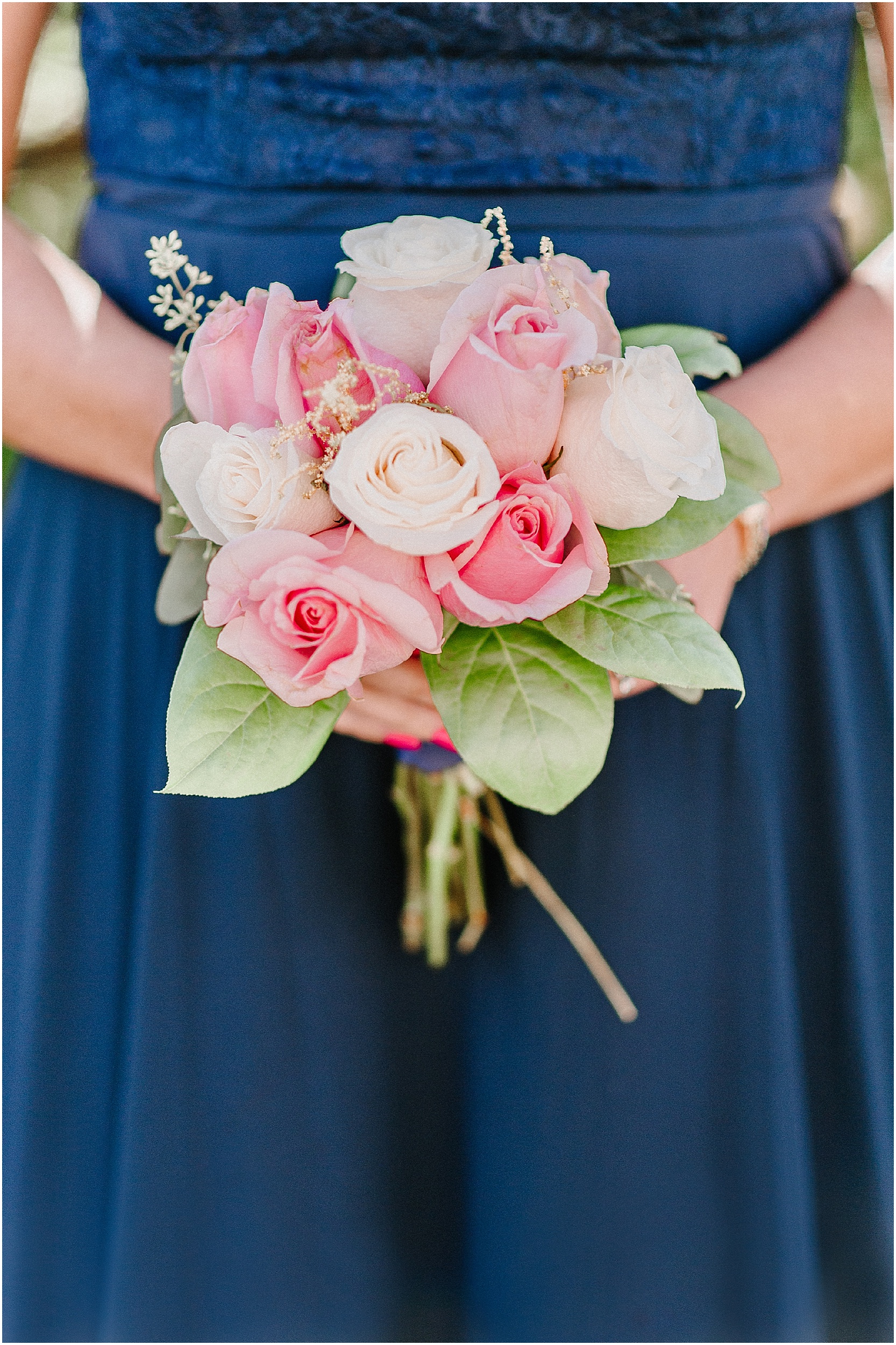 bridesmaid holding pink and green summer bouquet
