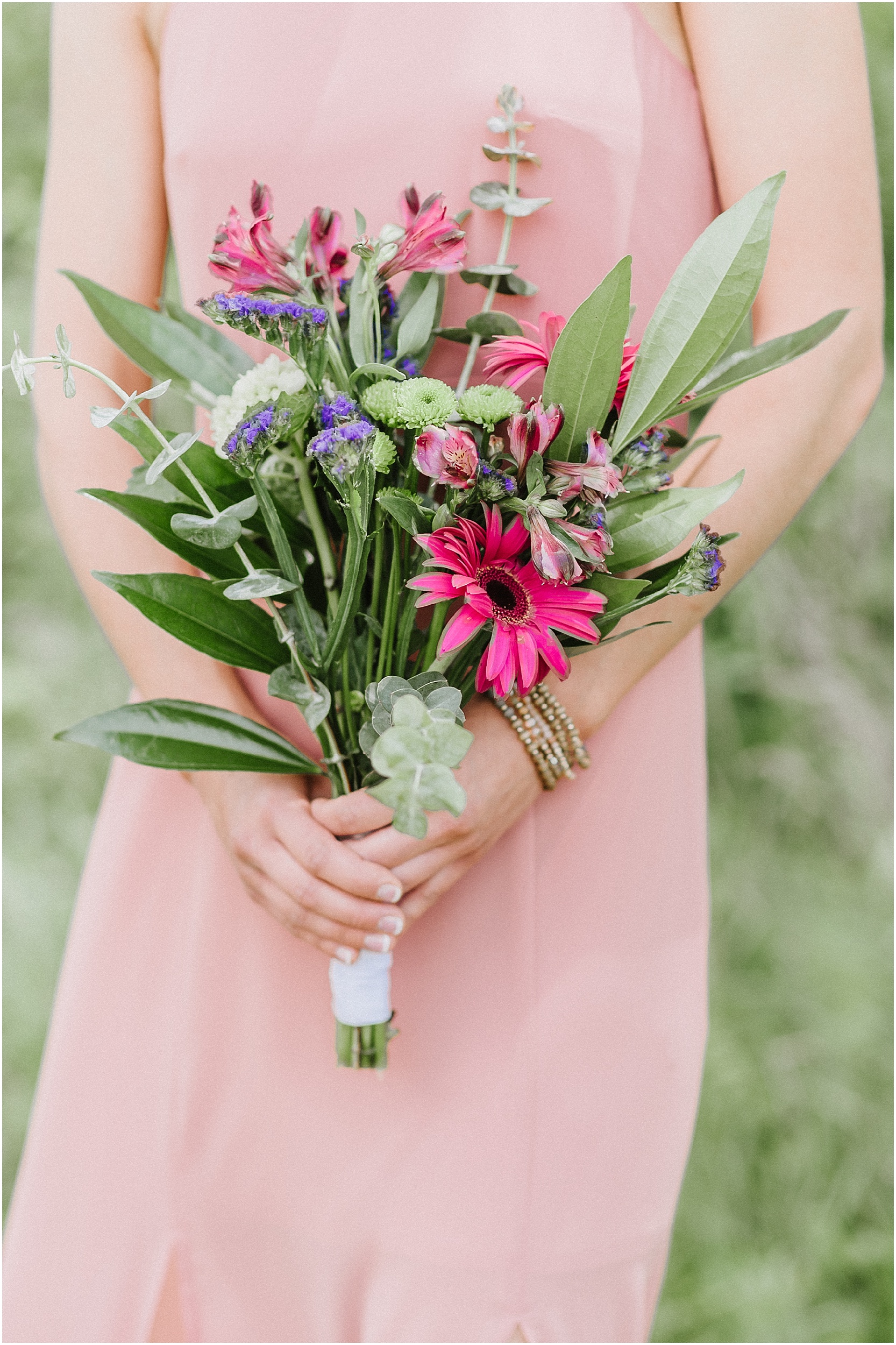 bridesmaid holding rustic pink wildflower bouquet