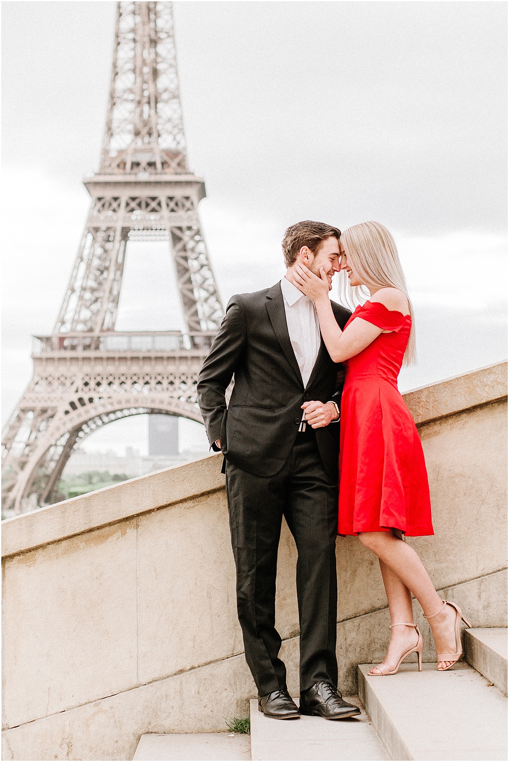 elegant couple in front of eiffel tower