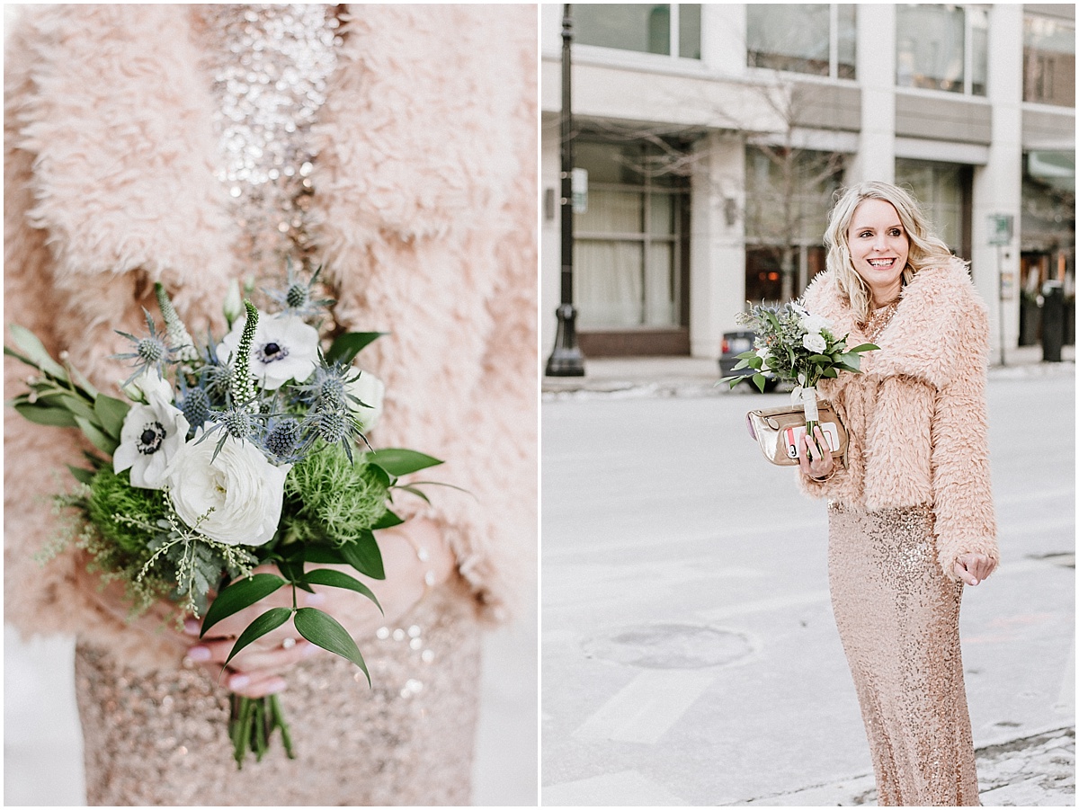 bride wearing rose gold sequence dress with fur jacket holding white and blue bouquet