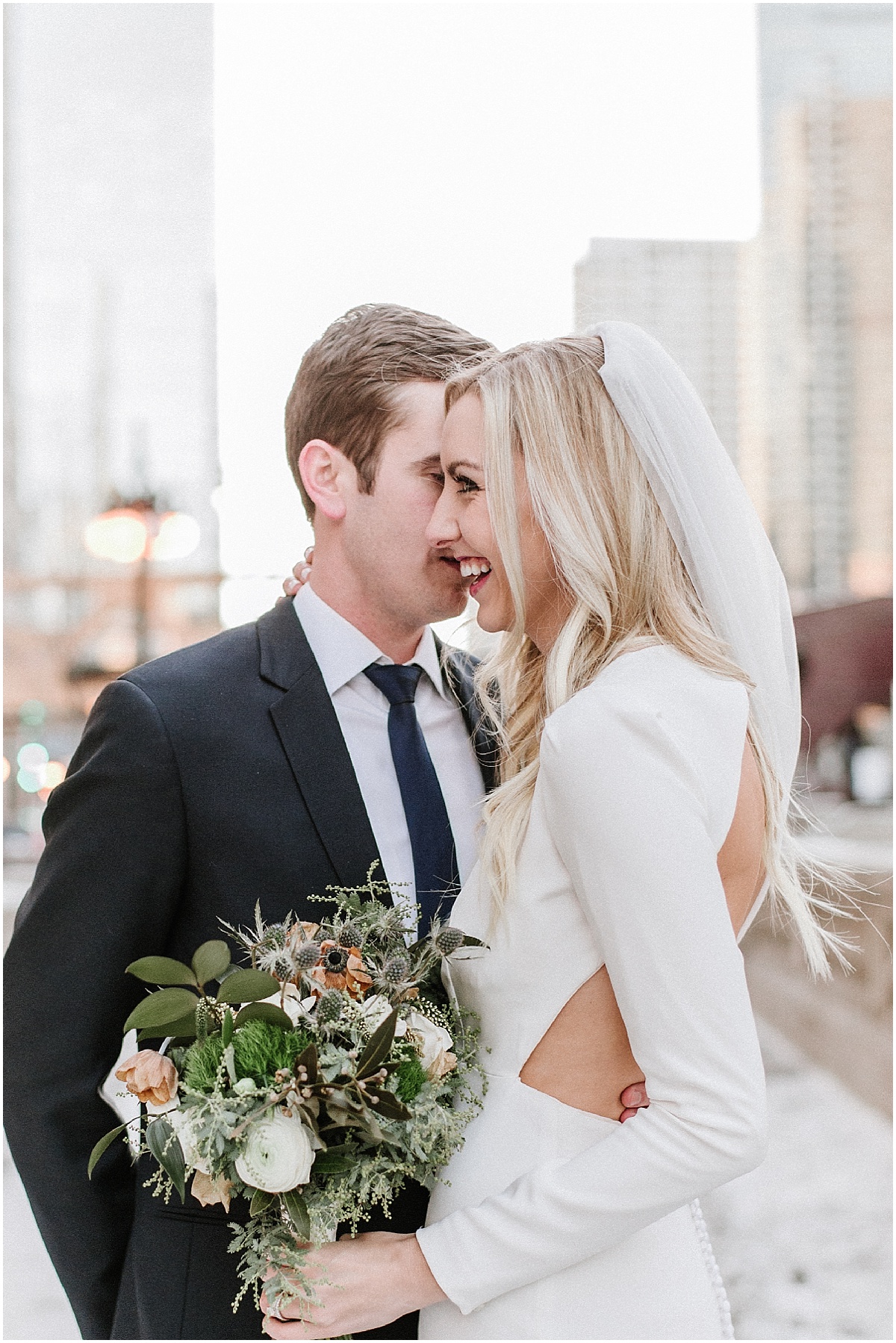 bride and groom hugging in downtown chicago