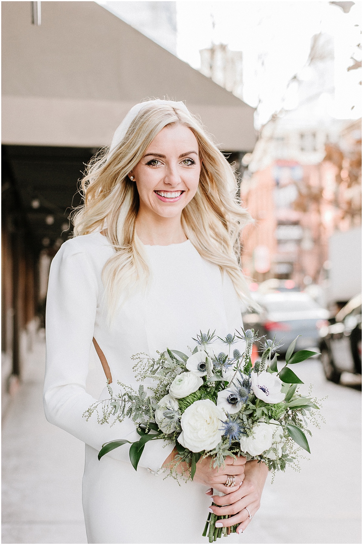 bride holding blue and white winter bouquet in chicago