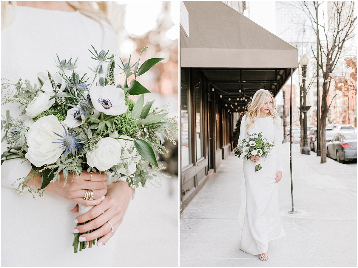 bride holding blue and white winter bouquet