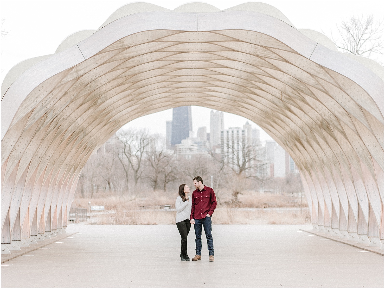 Engagement photos under archway at Lincoln Park