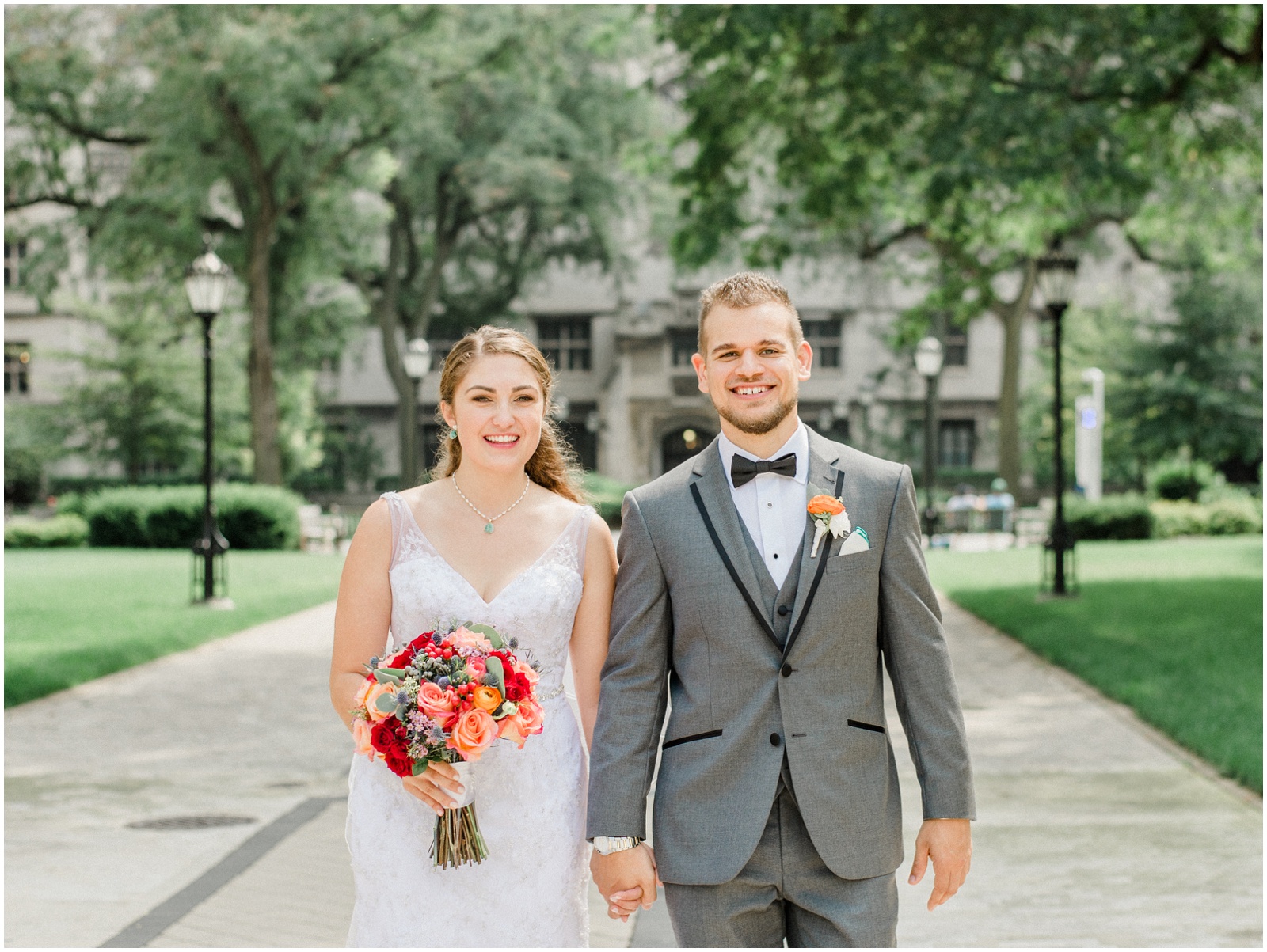 Bride and groom walking on University of Chicago campus
