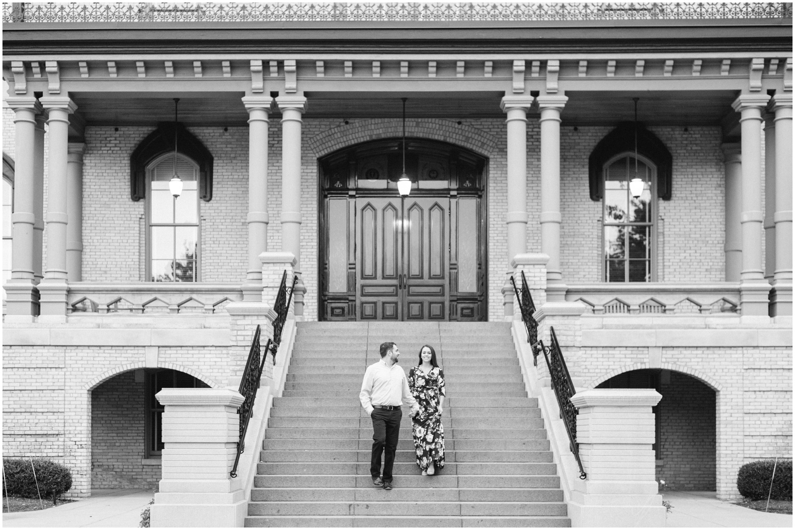 couple walking down stairs at notre dame golden dome building