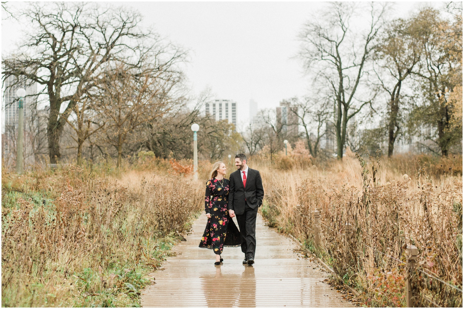 couple walking down boardwalk in chicago lincoln park