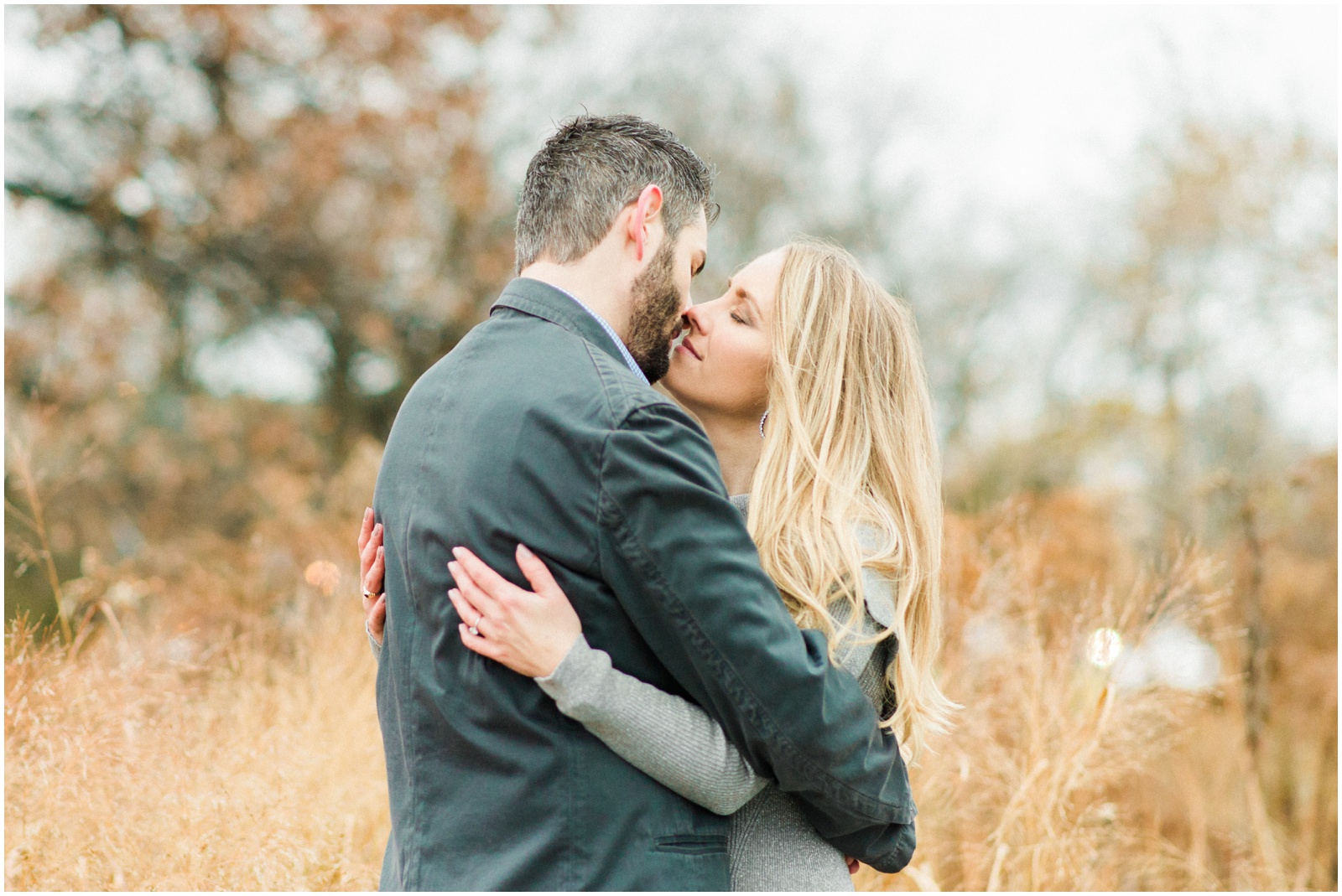 couple hugging in field of tall grass