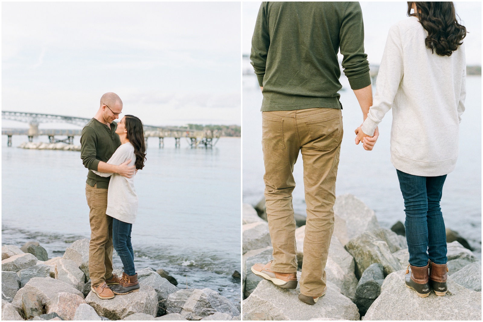 couple hugging on rocks by a river and bridge