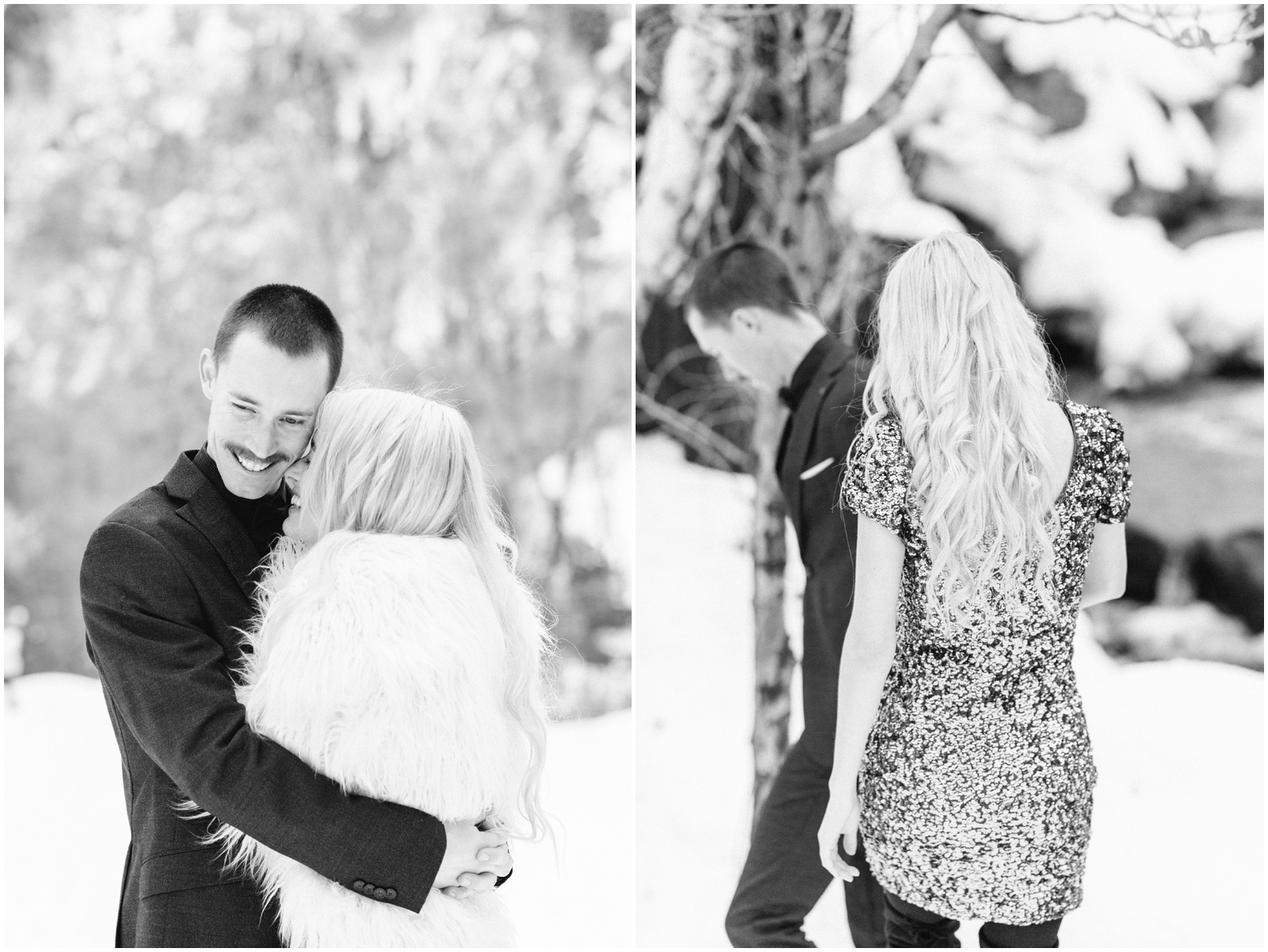 couple hugging and holding hands during engagement session in the snow