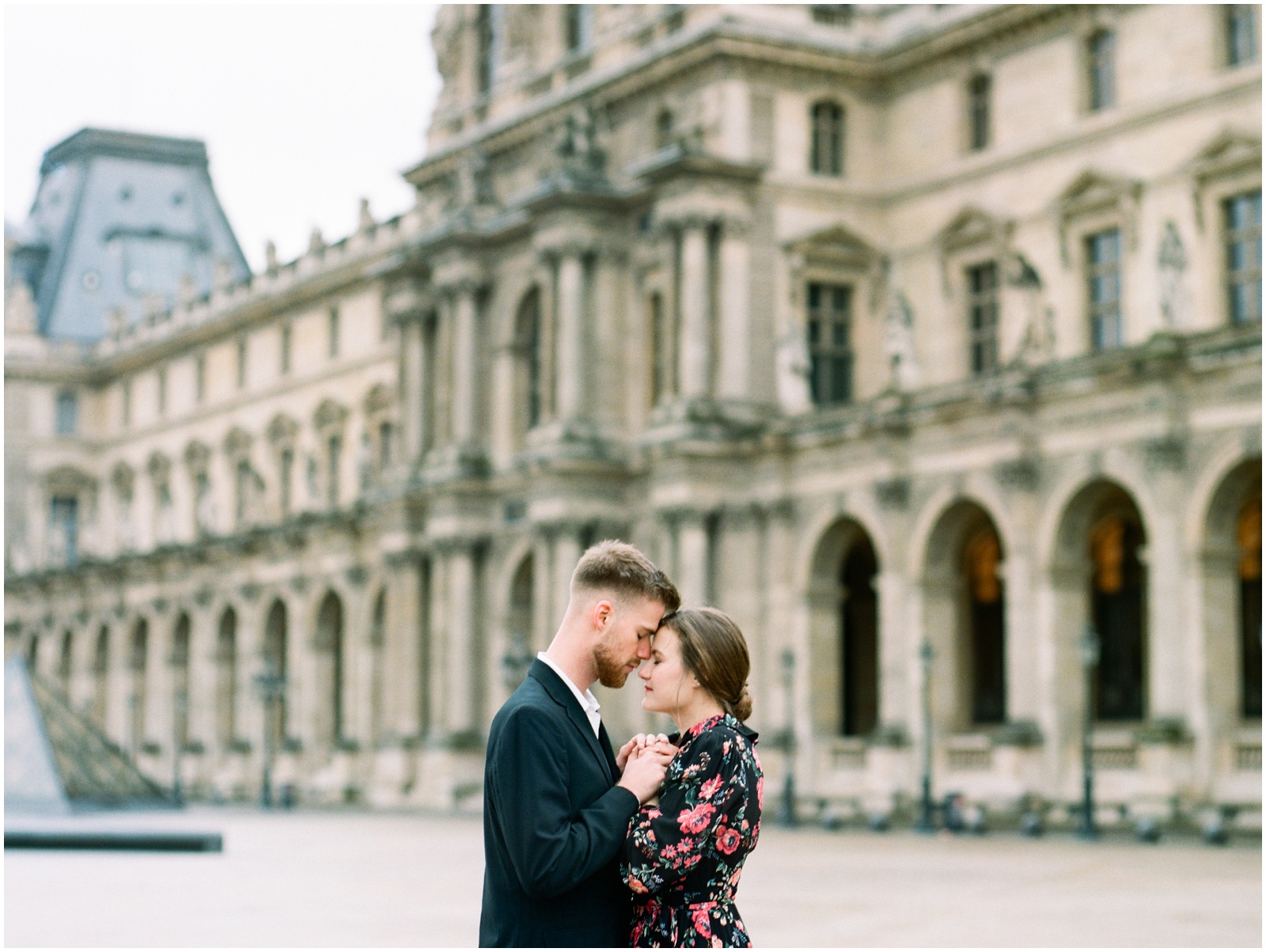 couple at Louvre Museum for engagement photos