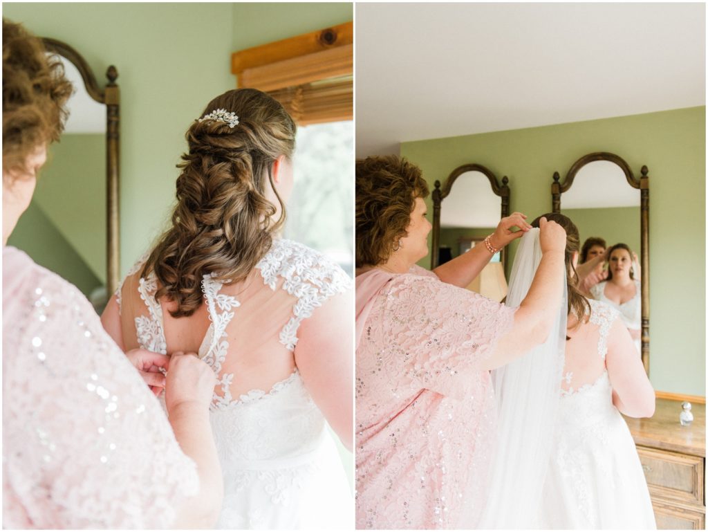 mother helping bride put on veil