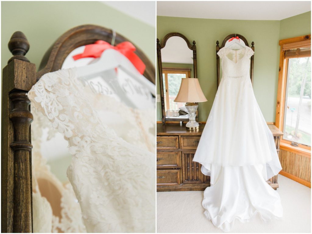 lace cap sleeve wedding dress hanging on dresser