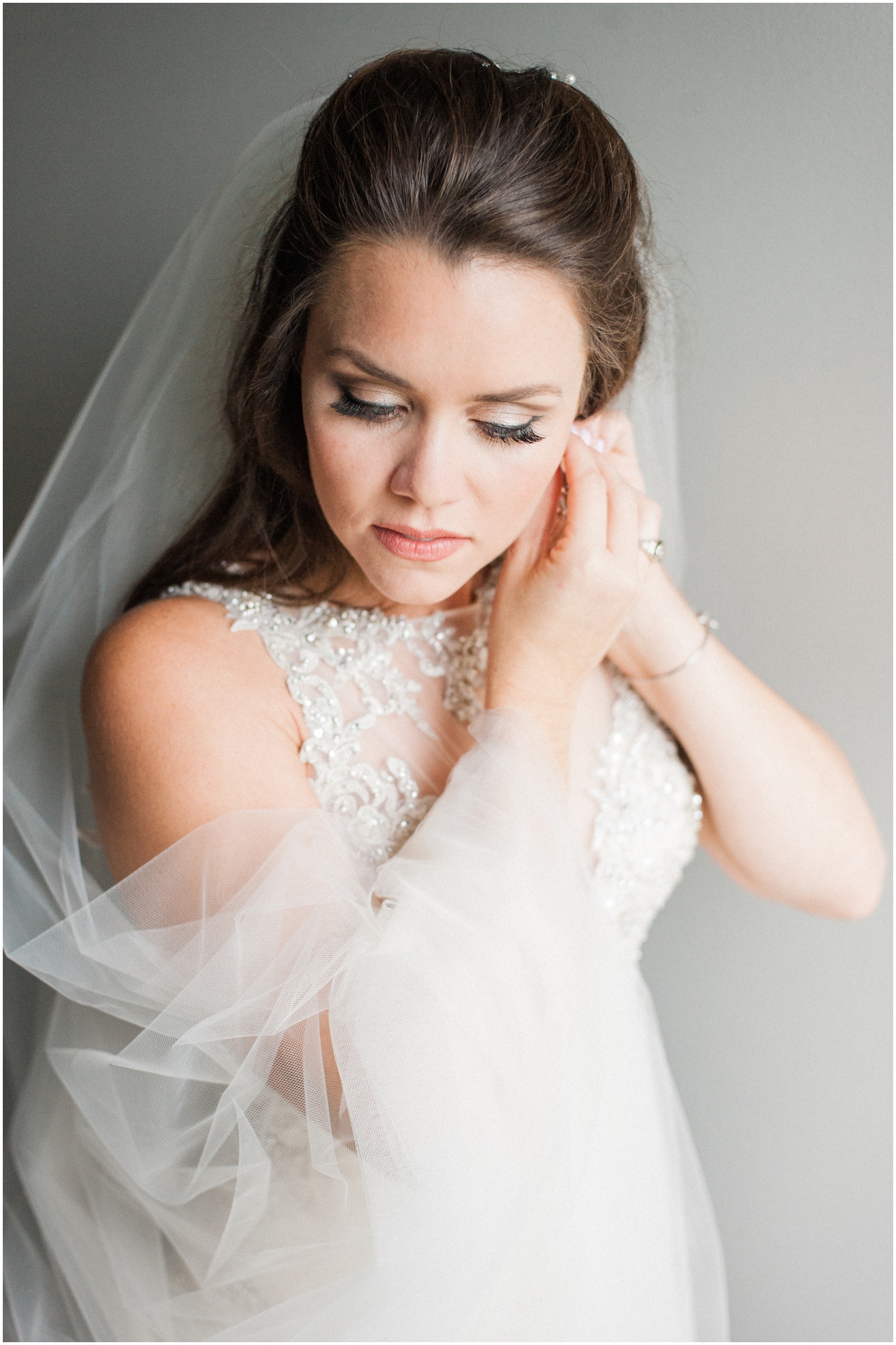 2019 Top Ten Bridal prep Portraits: bride putting on earrings