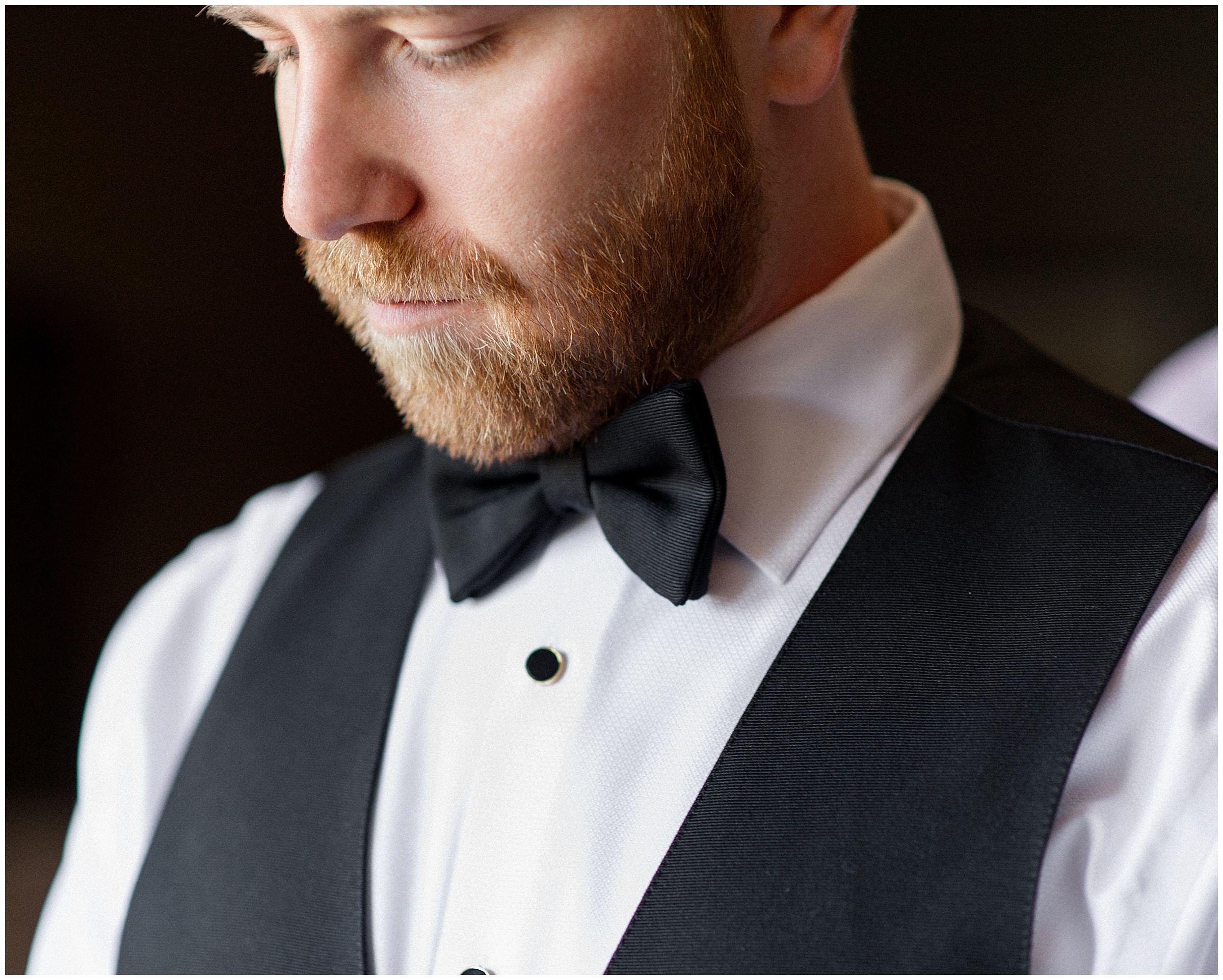 groom in black bowtie