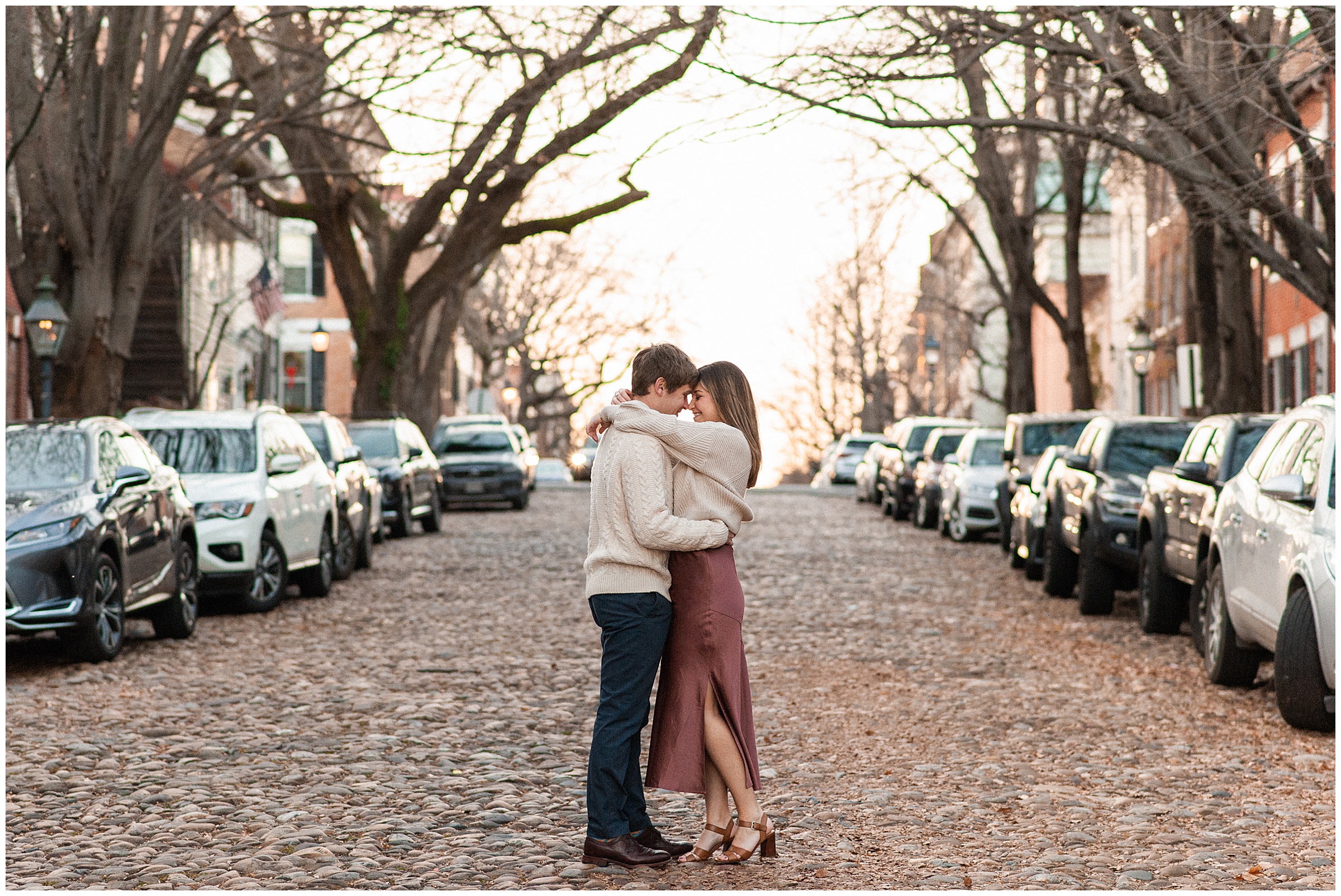 Engagement photos at Captain's Row cobblestone street Old Town Alexandria.